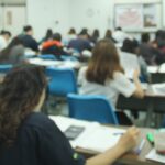 A school classroom full of young students learning.