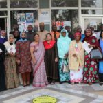 A group of attendants at the Skyline University Nigeria, CTH launch event. pictured holding brochures.