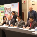 Signing of the MoU at the ActionInvest Caribbean inaugural ceremony/CTH launch event. Included in the image are representatives from Marriott, Ramada, GTA, THAG.